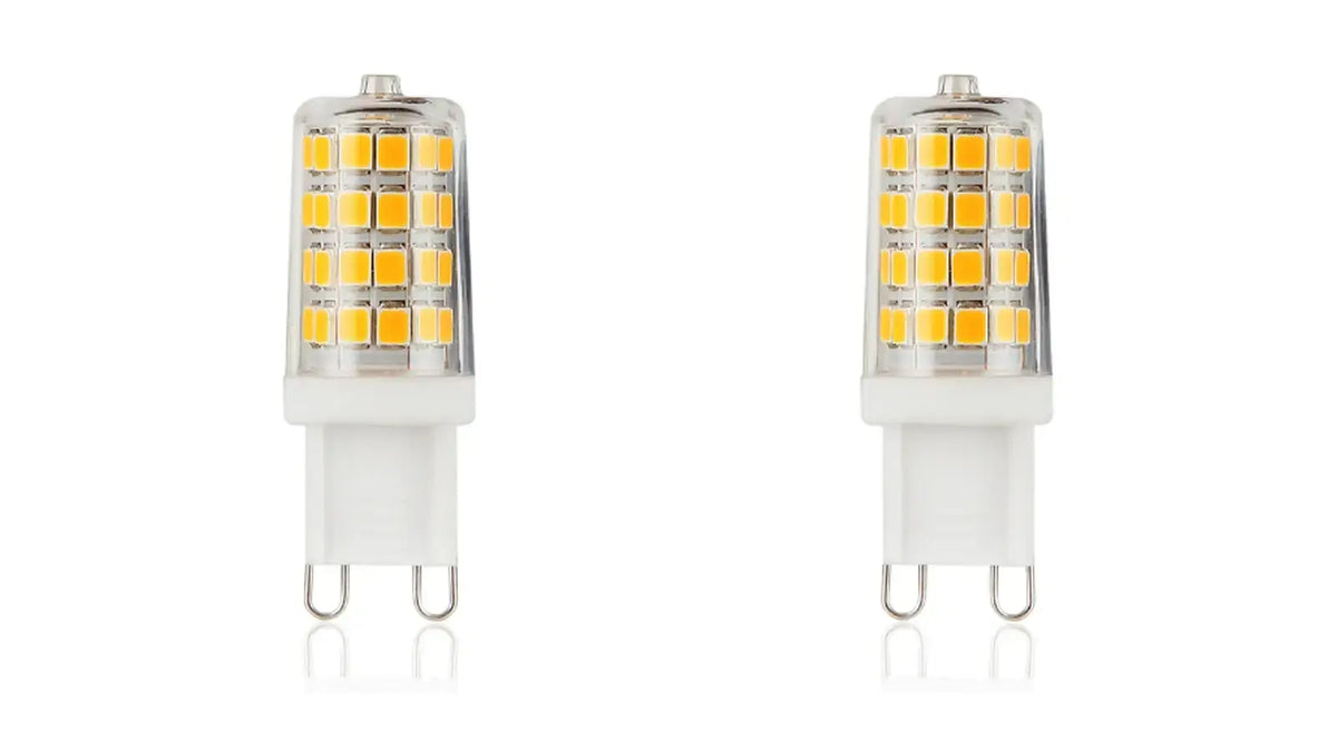 Two clear G9 LED capsule bulbs on a white background