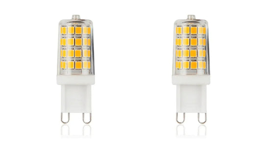 Two clear G9 LED capsule bulbs on a white background