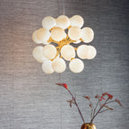Oscar Brushed Brass 28-Light Mid-Century Pendant with Gloss White Glass Shades