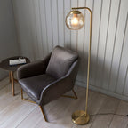 Dimple 1-Light Champagne Glass Floor Lamp with Brushed Brass Finish