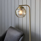 Dimple 1-Light Champagne Glass Floor Lamp with Brushed Brass Finish