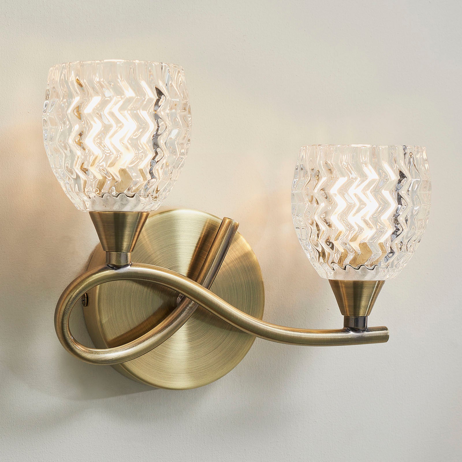 Boyer 2-Light Wall Sconce: Antique Brass & Curved Arms (Cut Glass Shades)
