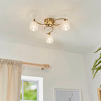Boyer 3-Light Semi-Flush Mount: Antique Brass & Curved Arms (Cut Glass Shades)