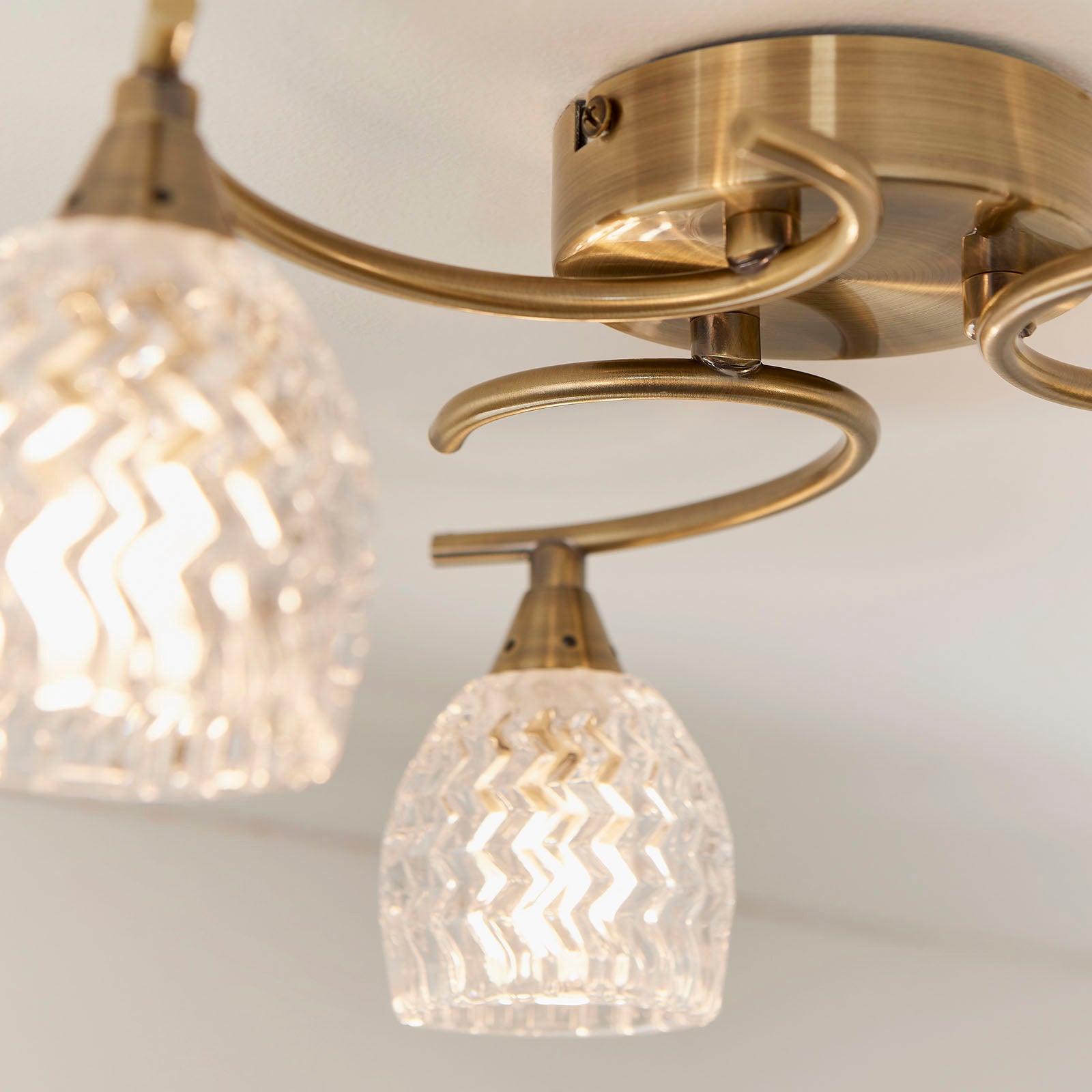 Boyer 3-Light Semi-Flush Mount: Antique Brass & Curved Arms (Cut Glass Shades)