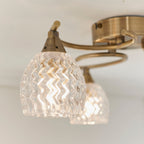 Boyer 3-Light Semi-Flush Mount: Antique Brass & Curved Arms (Cut Glass Shades)