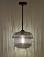 Contemporary pendant light with ribbed glass in interior space