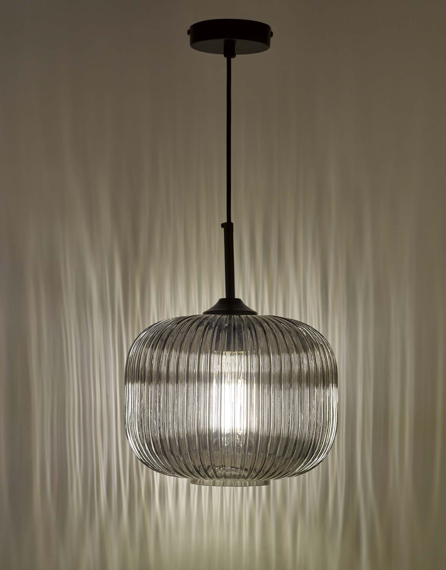 Contemporary pendant light with ribbed glass in interior space