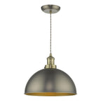 Industrial pendant light with dome shade and warm glow