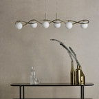 Modern bar pendant light above dining table setting