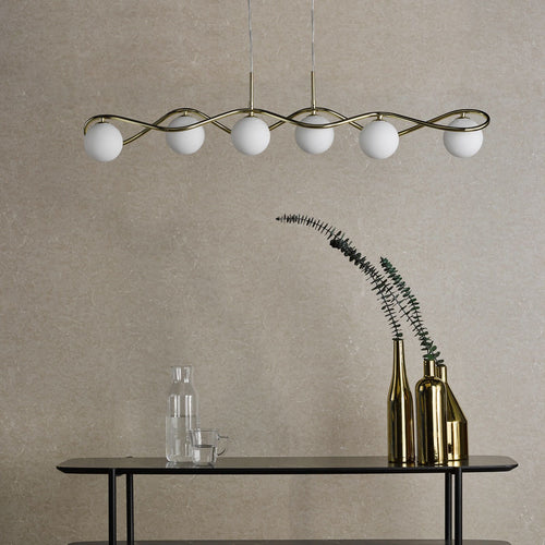 Modern bar pendant light above dining table setting