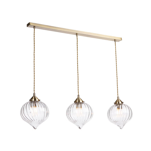 Glass pendant bar light above dining table setting