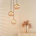 Amber glass cluster pendant light with antique gold finish