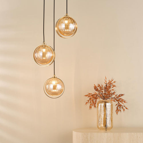Amber glass cluster pendant light with antique gold finish