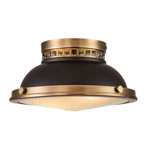 Black and brass flush mount ceiling light with domed shade and textured glass diffuser