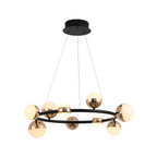 Black circular pendant with brass spheres and frosted glass globes hanging from ceiling.